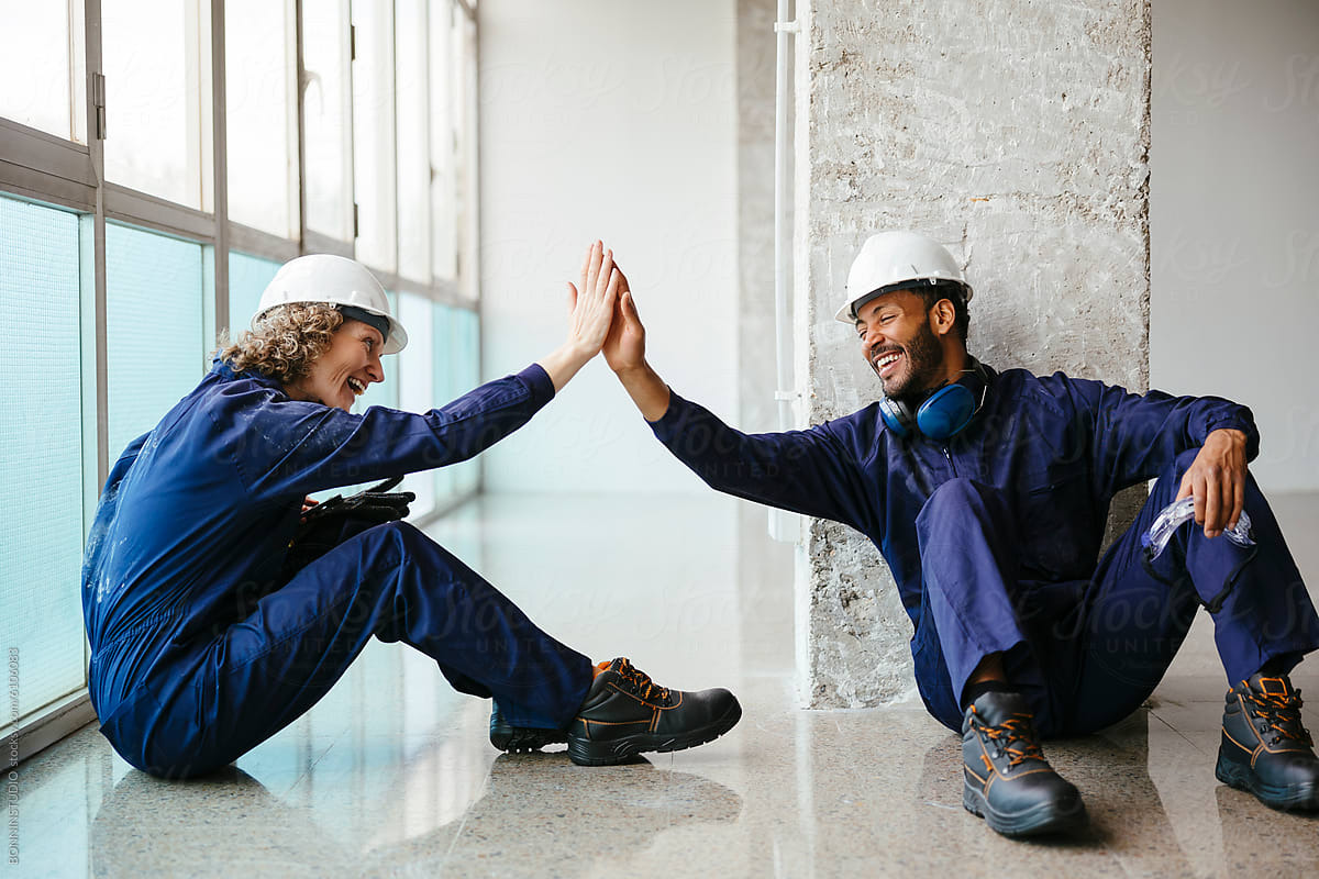 workers high fiving
